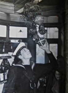 Alan Beckett places the bun on Good Friday 4th April 1958 - Widows Son pub tradition