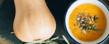 image shows a butternut squash and bowl of soup